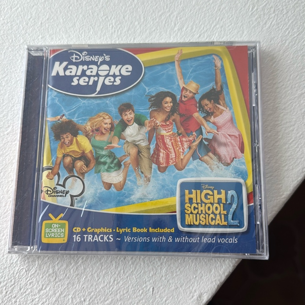 Disney karaoke series. High School Musical 2, brand new still wrapped-never usd